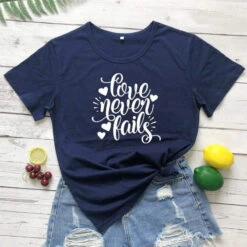 Christian T-Shirt Love Never Fails -Lord's Guidance H8e507795c86b4647be9e036e2fd8b440S
